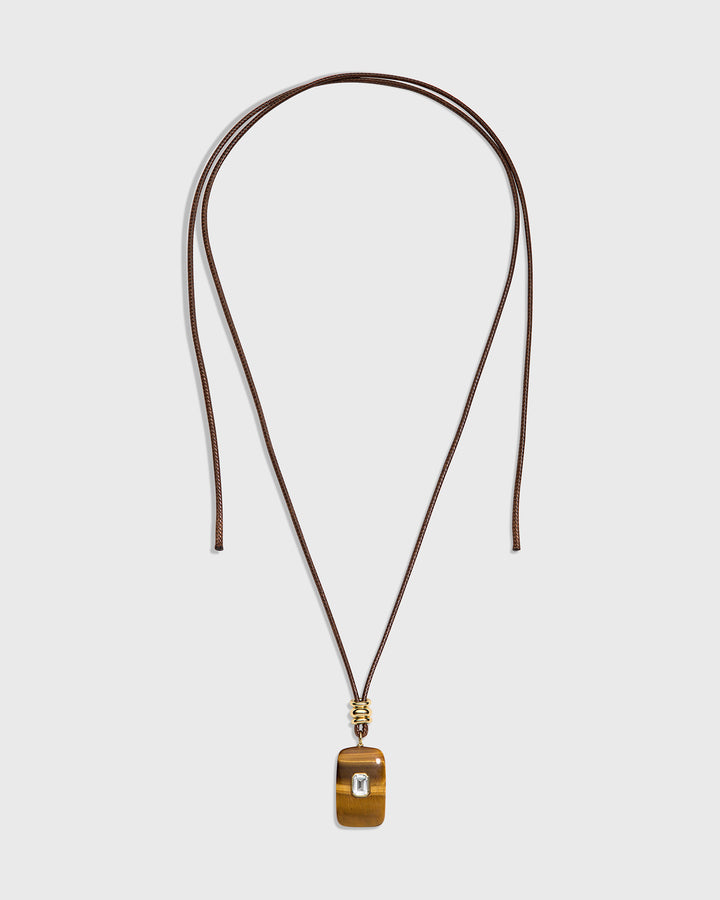 long pendant with tiger eye stone and tie in the back . colors are brown and clear