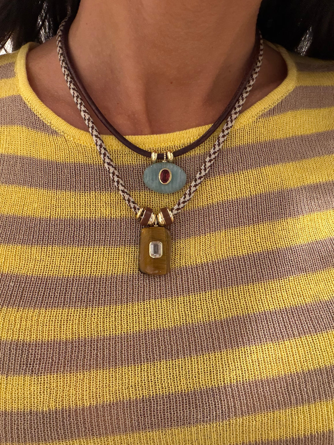 Necklace with pendant on a person